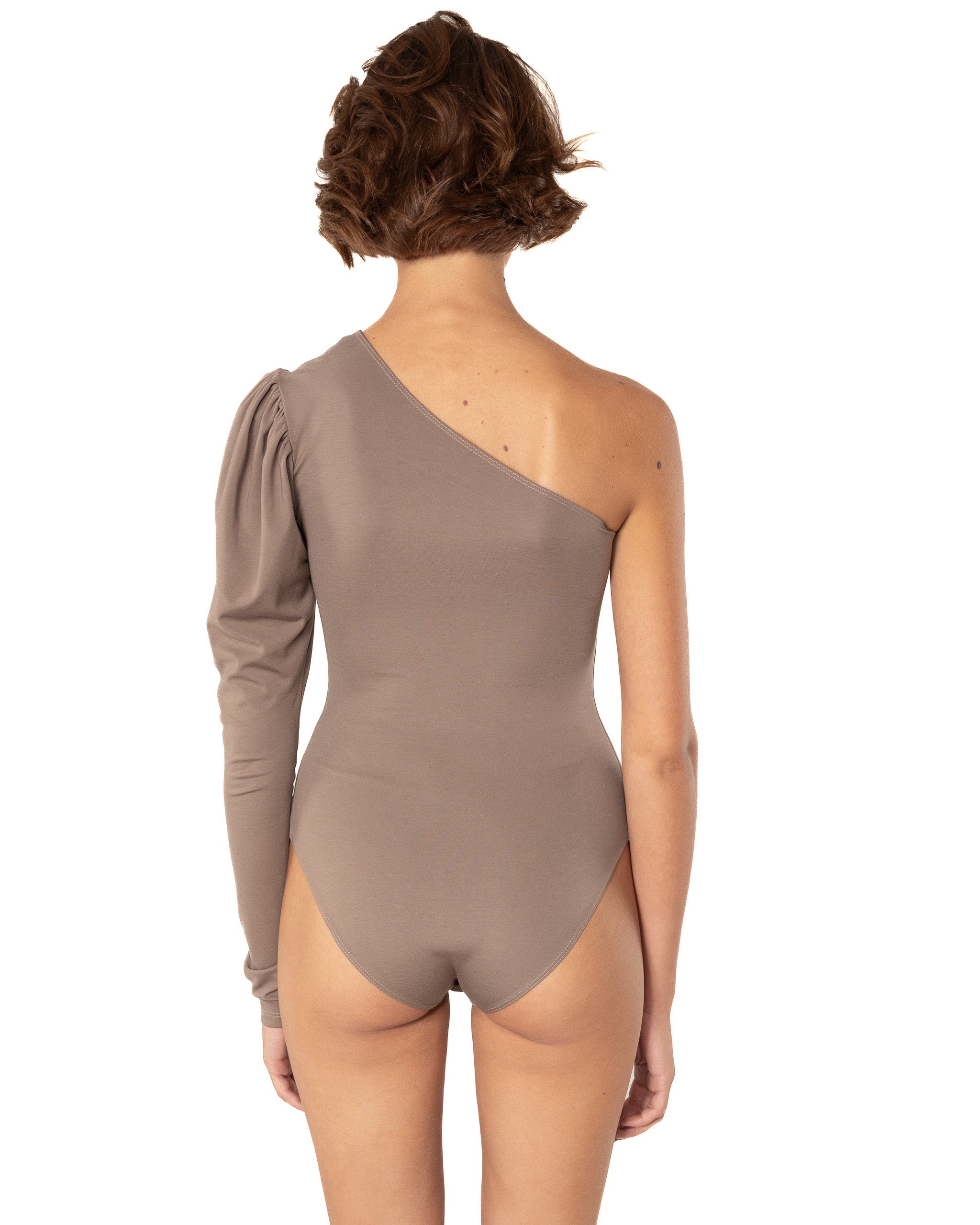 This bodysuit's model highlights the collarbone area and gracefully shows right shoulder and arm. The sleeve has wider body on the upper part which creates an elegant look.