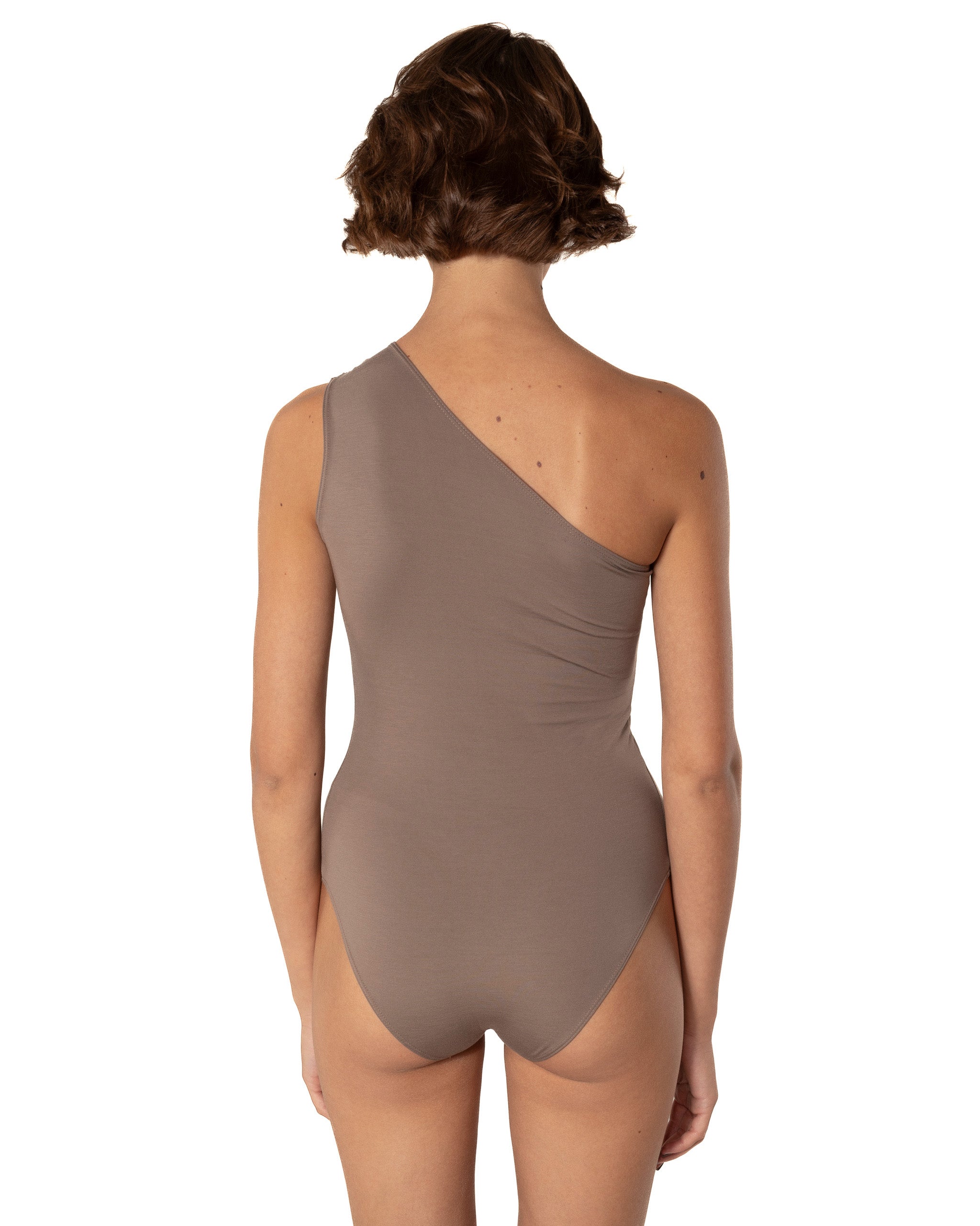 This bodysuit's model beautifully highlights the collarbone area and shows shoulders. Light shirring on the shoulder creates very refined look.