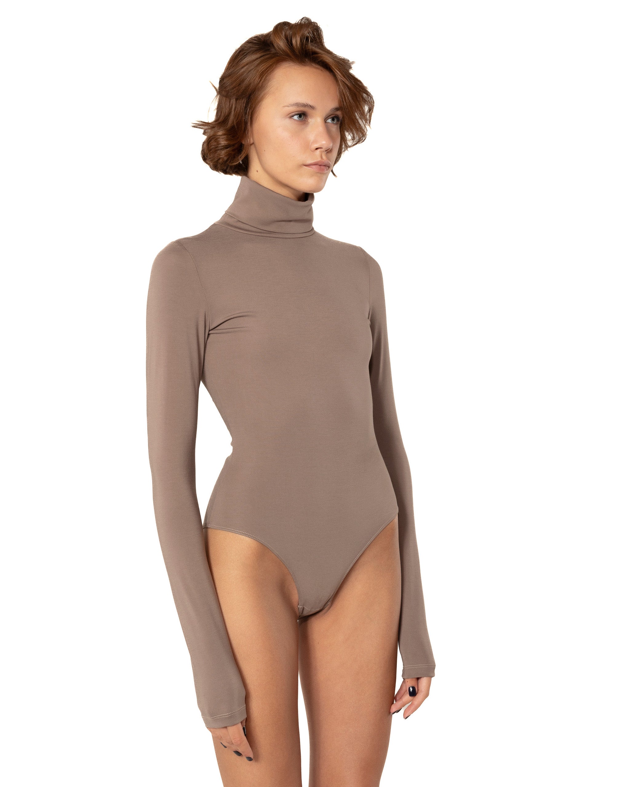 This bodysuit's model can be considered as your second skin. Long sleeve, hight turtle neck creates feeling of protection and comfort. Non-transparent fabric despite its elasticity makes it perfect for any occasion and activity.