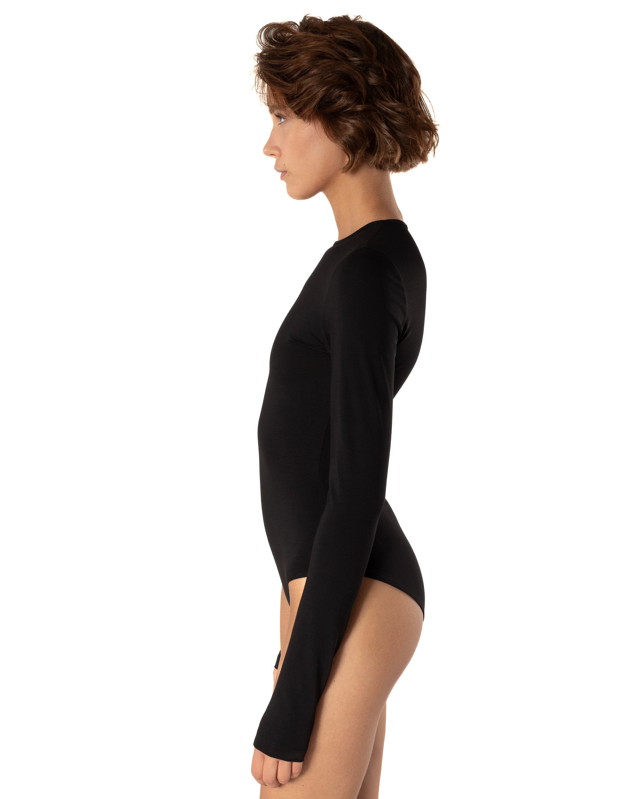 This bodysuit's model embraces femininity more than any piece of clothing possibly could. Non-transparent elastic fabric perfectly covers your body from the front and opens on the back flirtatiously.