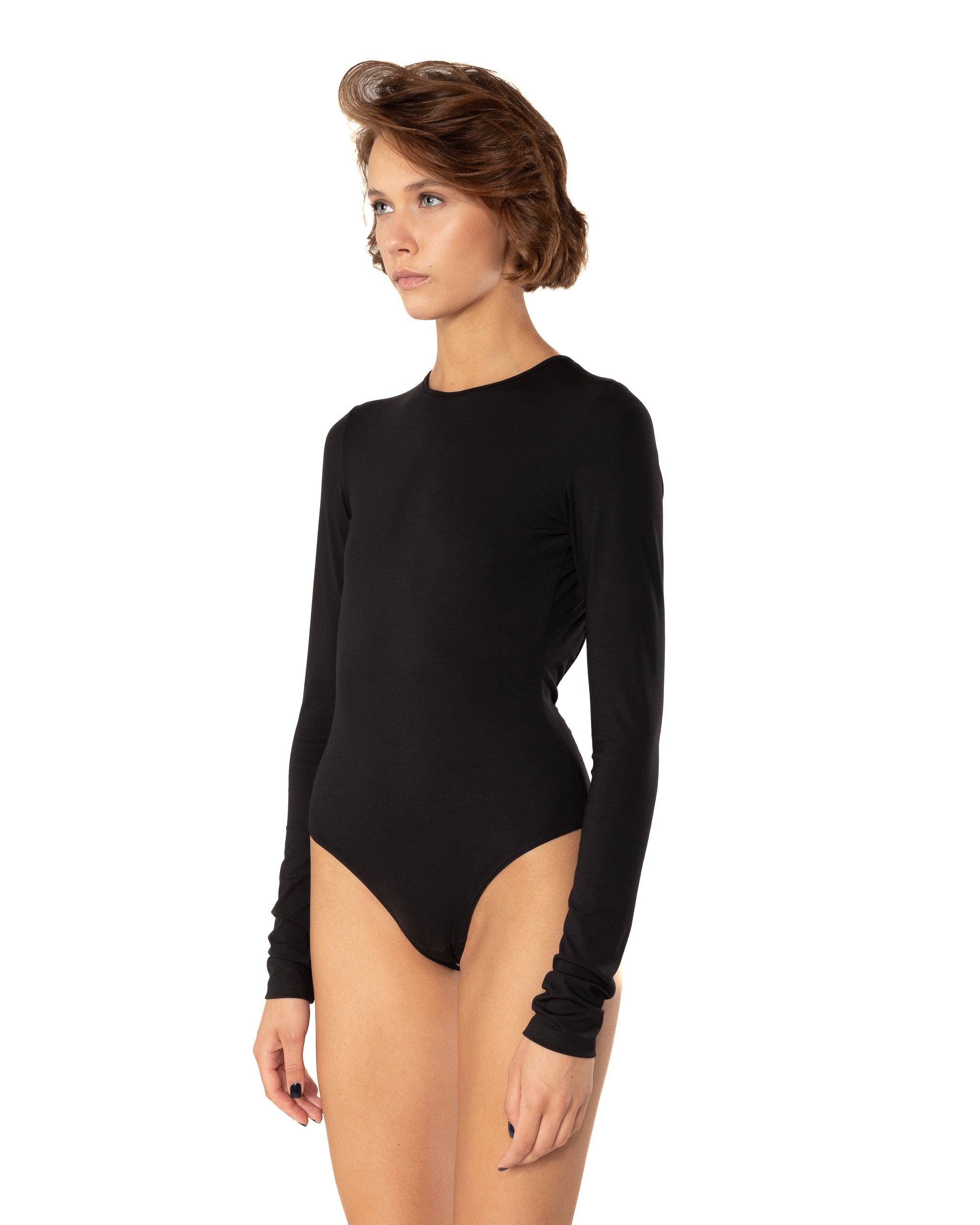 This bodysuit's model embraces femininity more than any piece of clothing possibly could. Non-transparent elastic fabric perfectly covers your body from the front and opens on the back flirtatiously.