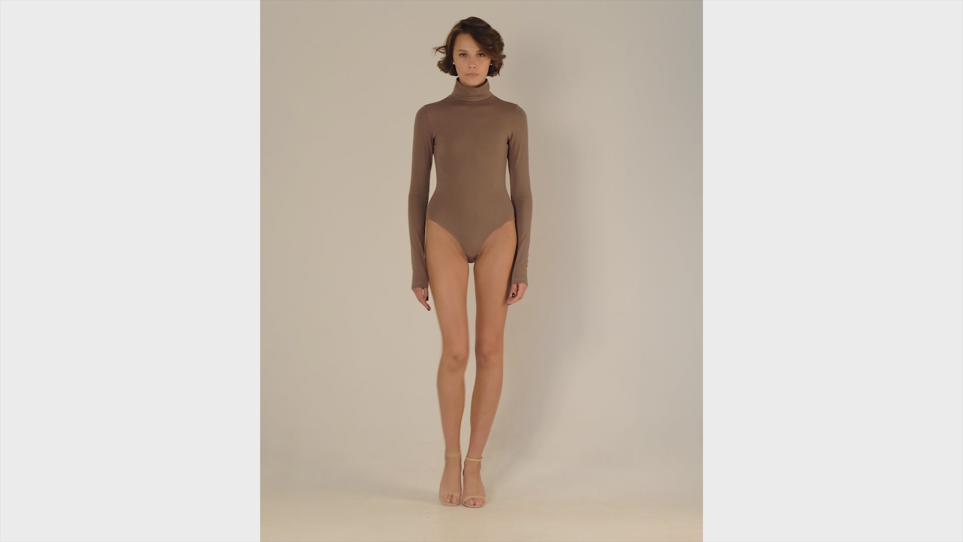 This bodysuit's model can be considered as your second skin. Long sleeve, hight turtle neck creates feeling of protection and comfort. Non-transparent fabric despite its elasticity makes it perfect for any occasion and activity.