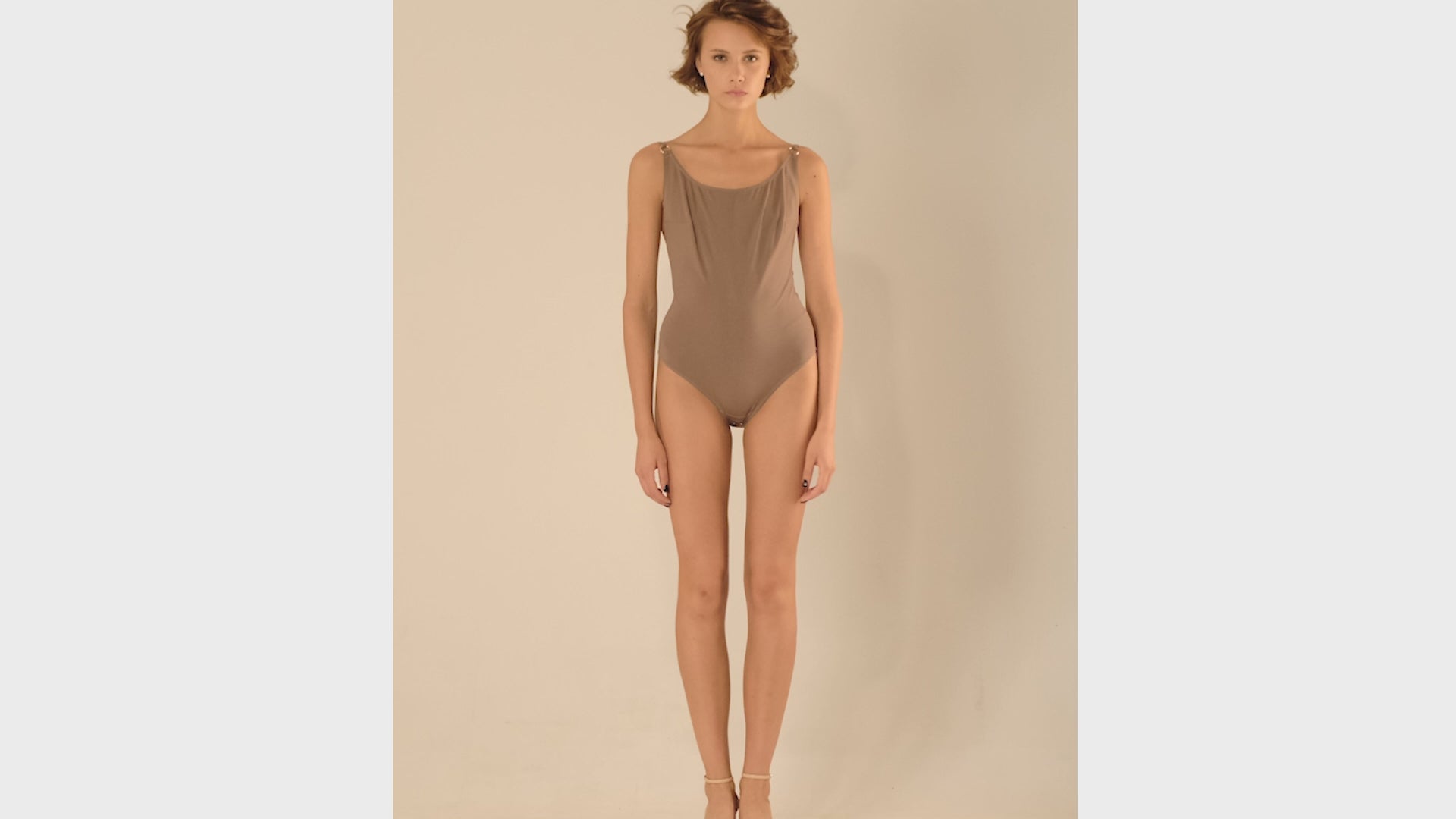 This bodysuit's model is designed for B+ cup. Perfect coverage in the front and super low cut on the back. Adjustable straps can be worn crossed on a back.