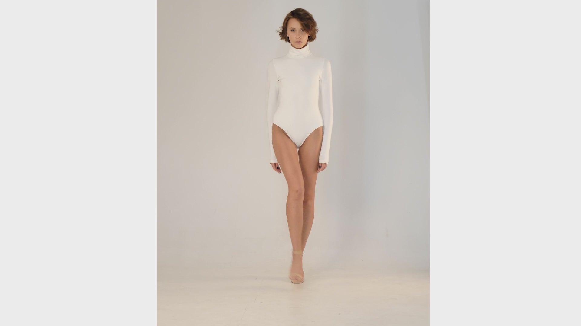 This bodysuit's model can be considered as your second skin. Long sleeve, hight turtle neck creates feeling of protection and comfort. Non-transparent fabric despite its elasticity makes it perfect for any occasion and activity.