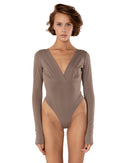 This bodysuit's model gives elegant sporty vibe. V-shape decollate and open back creates slightly provocative but very strong look.