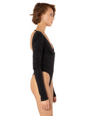 This bodysuit's model gives elegant sporty vibe. V-shape decollate and open back creates slightly provocative but very strong look.
